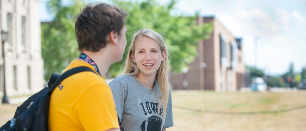 Two students on campus conversing